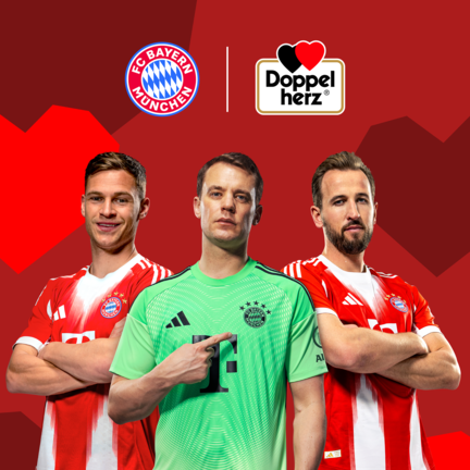 Three FC Bayern Munich players stand in front of a red background with geometric heart shapes. From left to right: Harry Kane, Jamal Musiala and Manuel Neuer. Above them are the FC Bayern Munich logo and the Doppelherz logo, indicating a brand partnership.